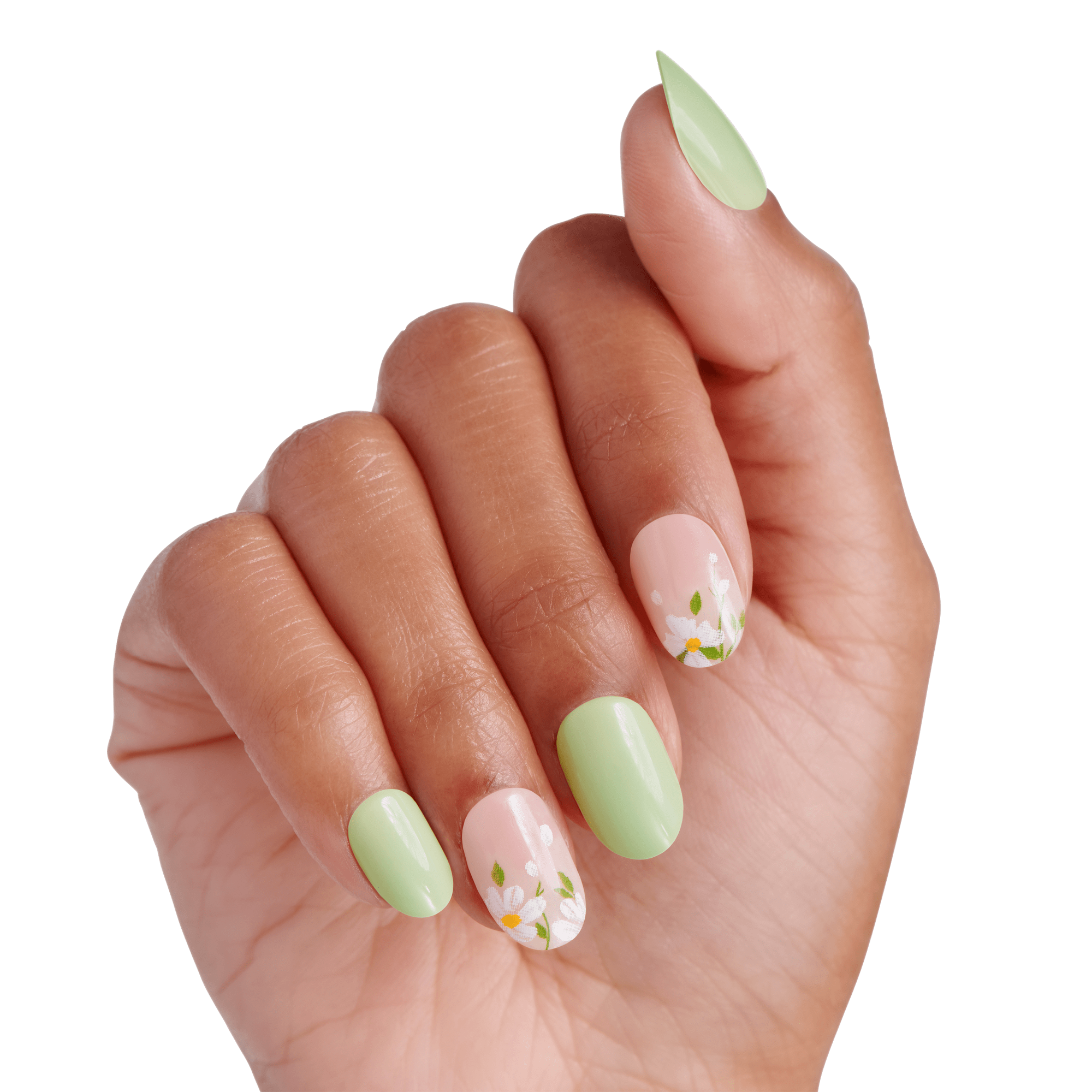 Hand displaying manicure with pale green and floral-patterned nails on white background.