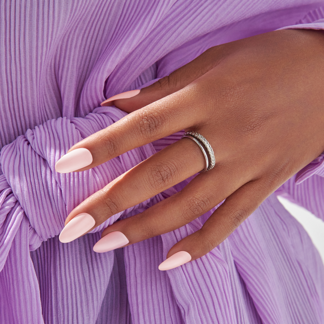 imPRESS nails in almond shapes featuring a light pink color