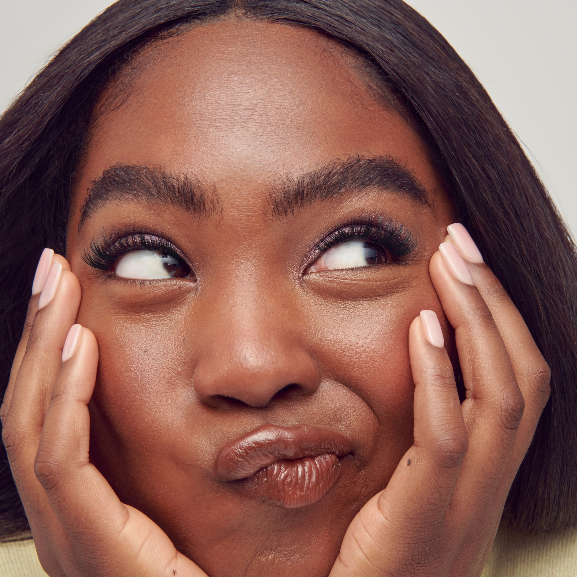 Woman with hands on face, close-up