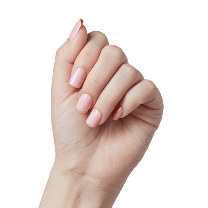 Close-up of a hand modeling a press-on manicure in &