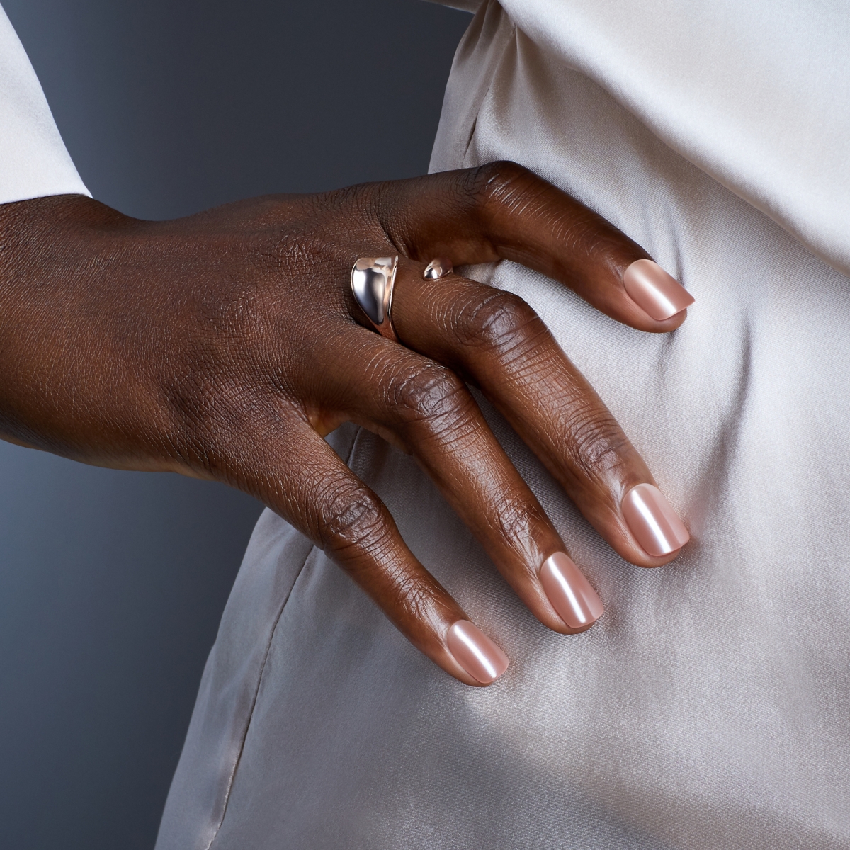 A hand modeling imPRESS Color FX press-on nails in &