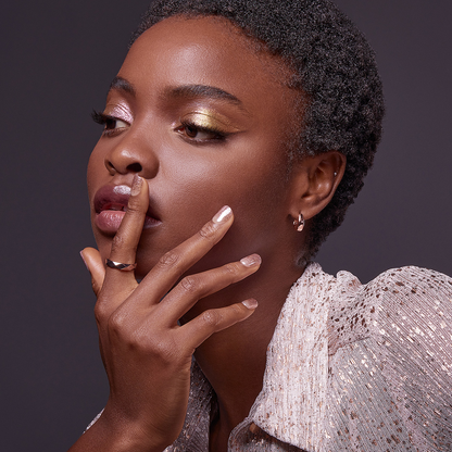 Woman modeling a press on manicure from imPRESS in &