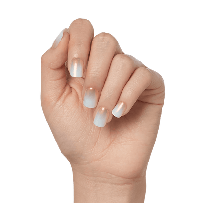 Close-up of a hand modeling press-on nails from imPRESS in &