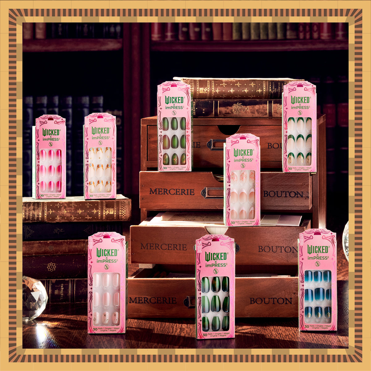 Wicked imPRESS press-on nail sets displayed on wooden drawers and vintage books.