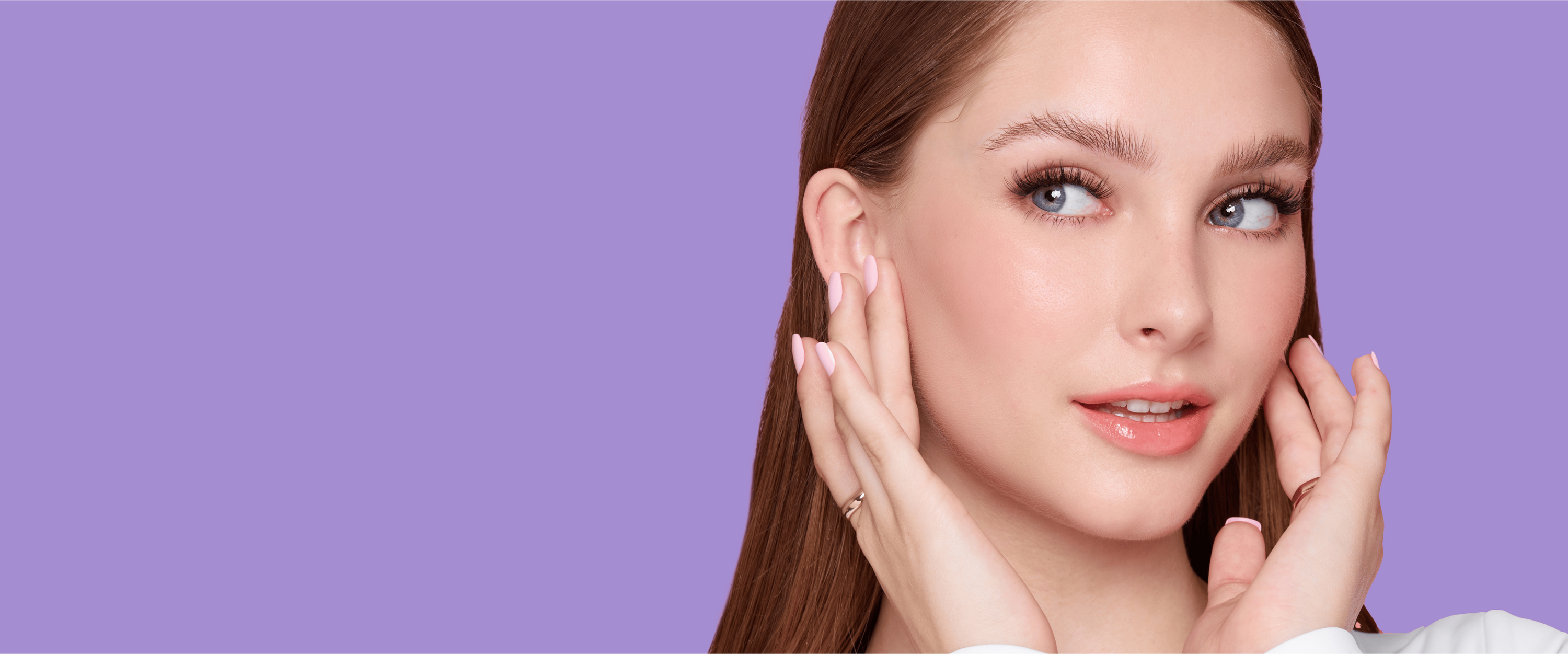 A woman with naturally wispy lashes. She's wearing false lashes from imPRESS.