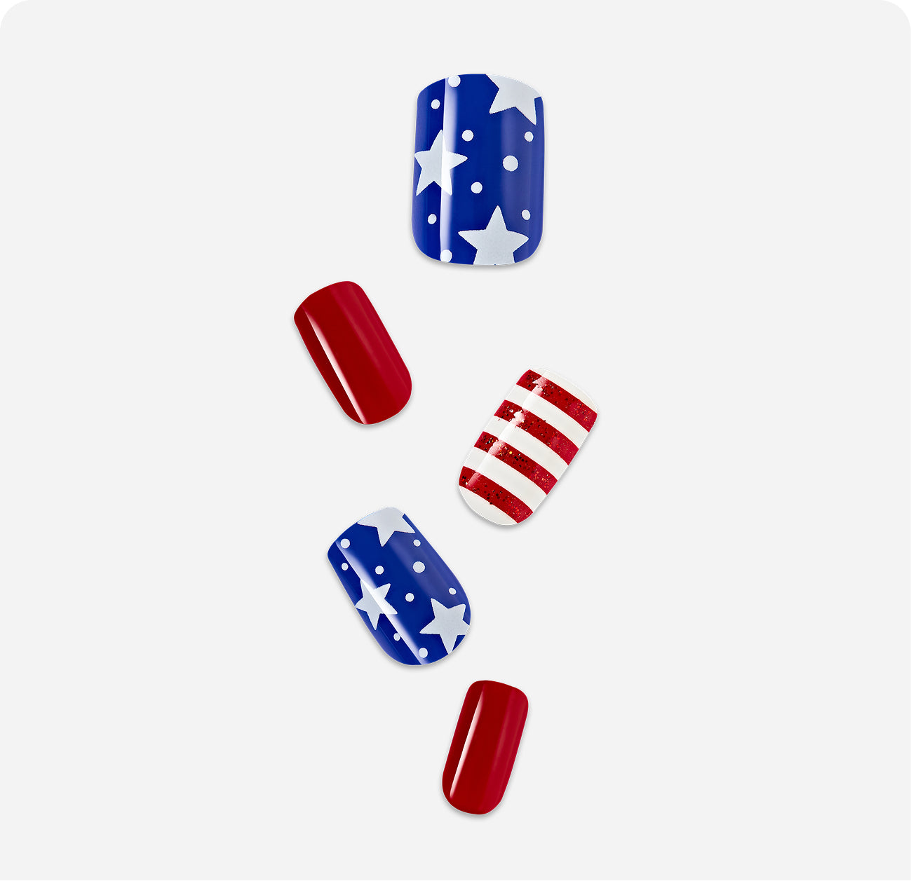 Patriotic nail wraps featuring stars, stripes, and solid red designs in American flag colors.