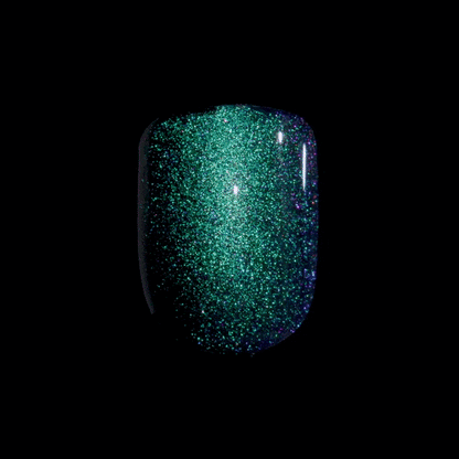3D imaging of a short, squoval shaped press-on nail in a dark green, mirrored, cat-eye effect. Nail is from &
