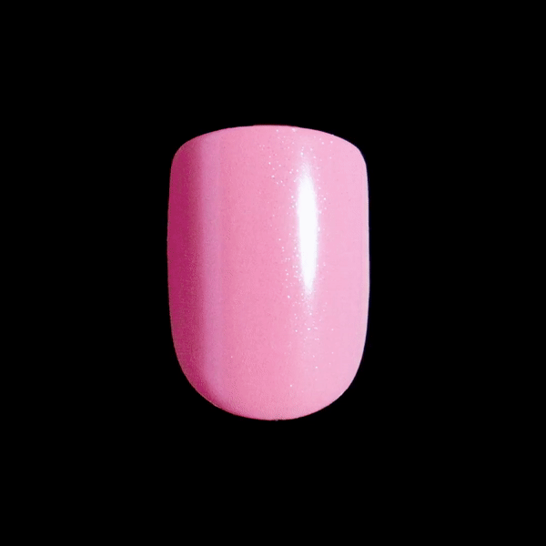 A single, shimmery pink press-on nail in short, squoval shape. Artificial nail is style, &