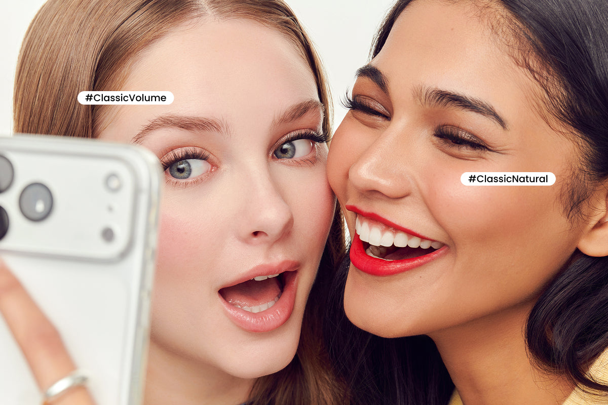 Two women taking a selfie with a phone, labeled 'Classic Volume' and 'Classic Natural'.