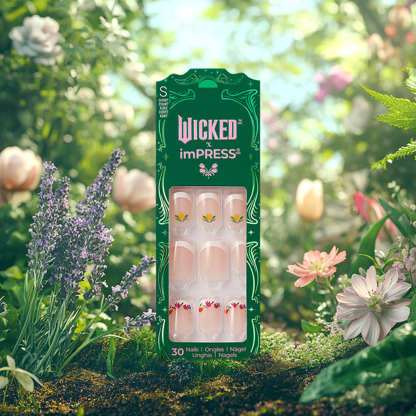 Wicked x imPRESS press-on nails package with floral designs in garden setting.
