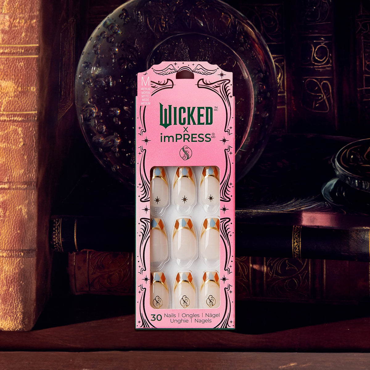Wicked x imPRESS press-on nails package with white and gold design, 30 nails displayed against theatrical backdrop.
