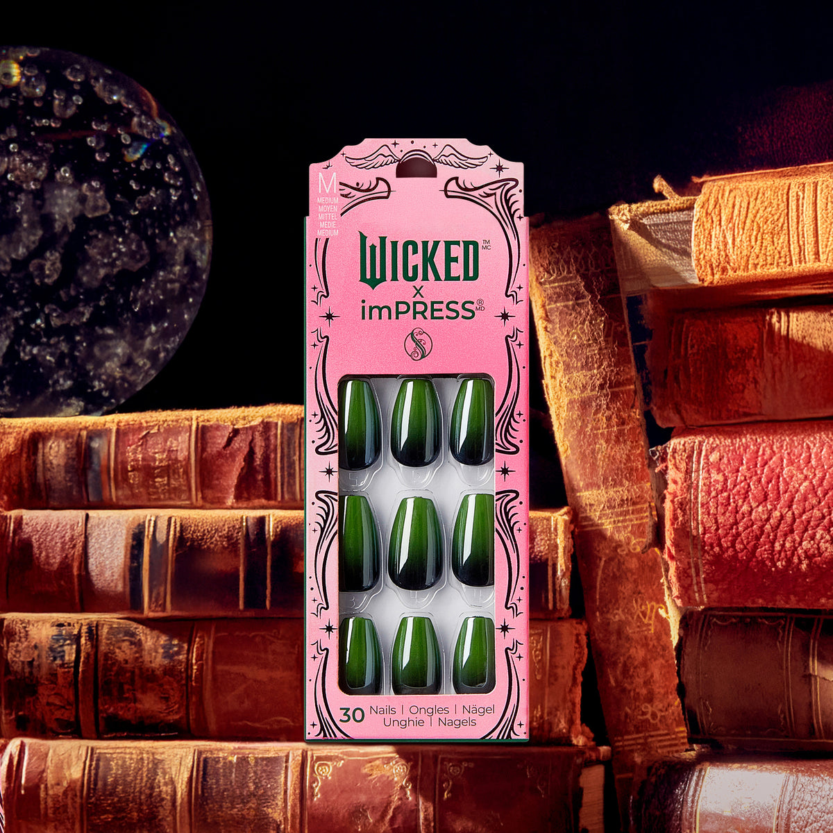 Wicked imPRESS press-on nails in forest green, displayed on antique books.