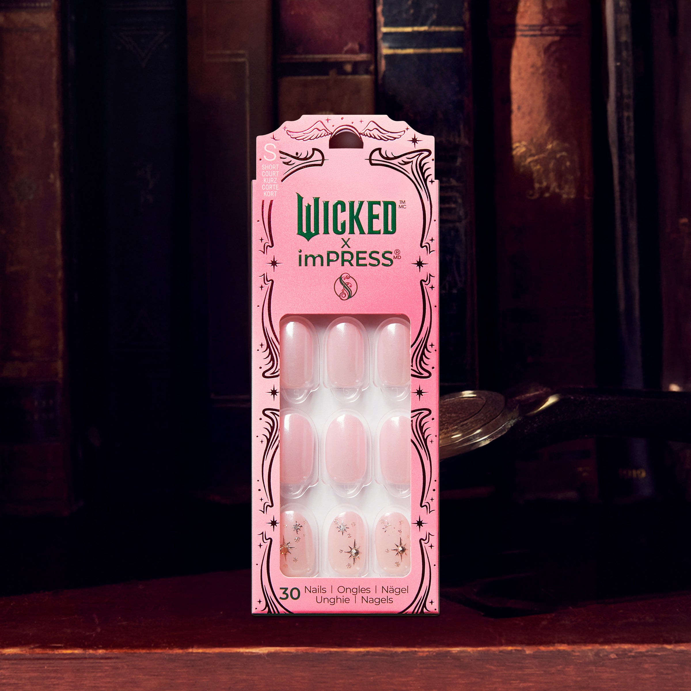 Wicked x imPRESS press-on nails package with 30 nails in pink and white designs