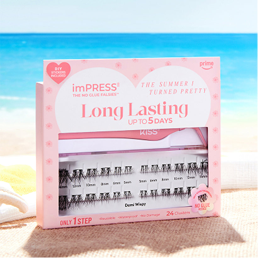 imPRESS Long Lasting press-on nails in pink packaging on beach sand