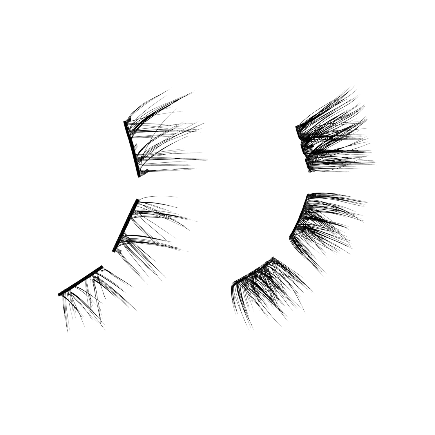 Four pairs of false eyelashes displayed in varying styles and densities.